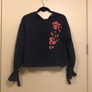 Blue top with pink embroidery